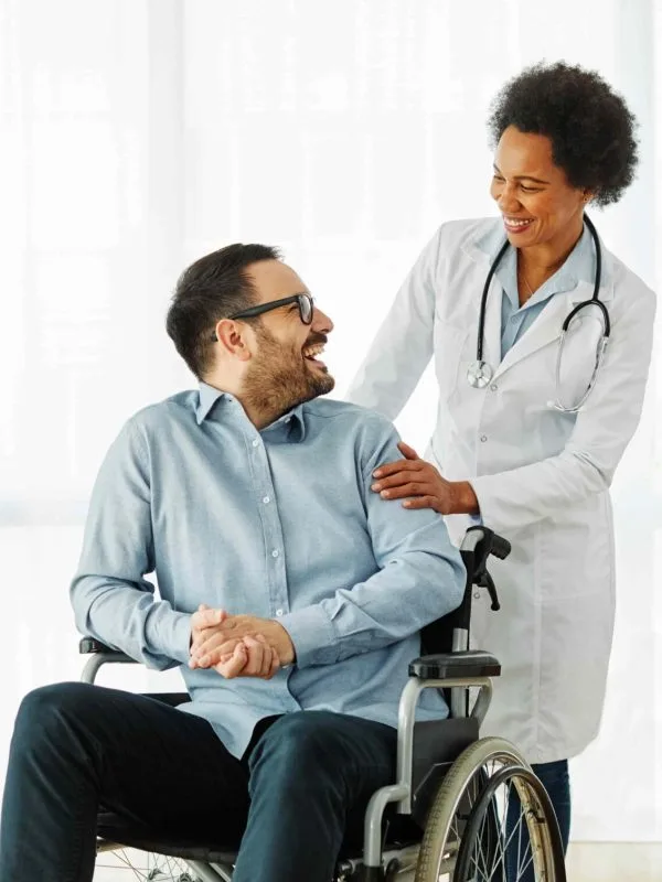 Doctor with a patient in a wheelchair